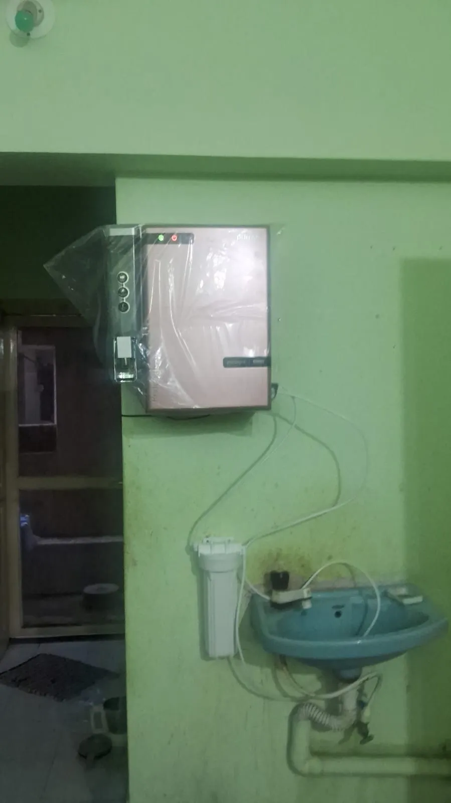 Point-of-use purifier fitted at a kitchen sink